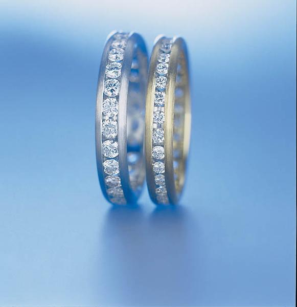 PLATINUM AND DIAMOND WEDDING RING 38MM - RING ON LEFT