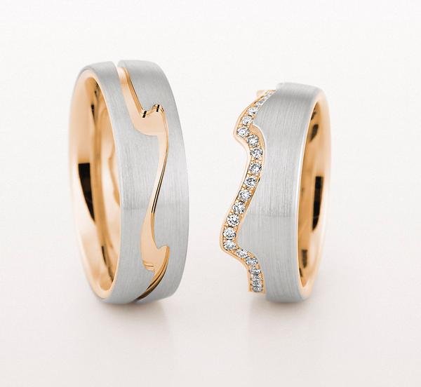 WEDDING RING TWO COLORS GOLD WITH WAVE DESIGN IN CENTER 65MM - RING ON LEFT
